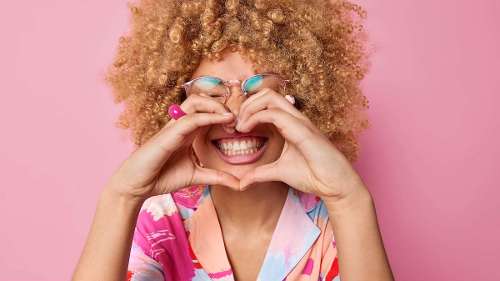 Happy patient showing healthy smile at Lakewood CO dentist