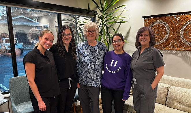 Golden Hill Family Dentistry | Five dental office team members standing and smiling in a reception area.